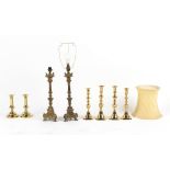 Property of a gentleman - a pair of early 19th century brass candlesticks, 7.5ins. (19cms.0 high;