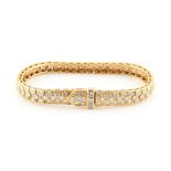 David Morris, attributed to - an unmarked yellow gold (tests 18ct) diamond link bracelet, pave set