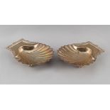 Property of a deceased estate - a pair of early 19th century George IV silver scallop shell butter