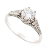 A diamond single stone ring, the round brilliant cut diamond weighing approximately 1.03 carats,