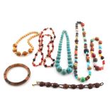 Property of a lady - a bag containing assorted costume jewellery, mostly bead necklaces, including