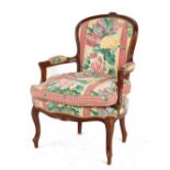 Property of a gentleman - a Victorian style floral upholstered armchair.