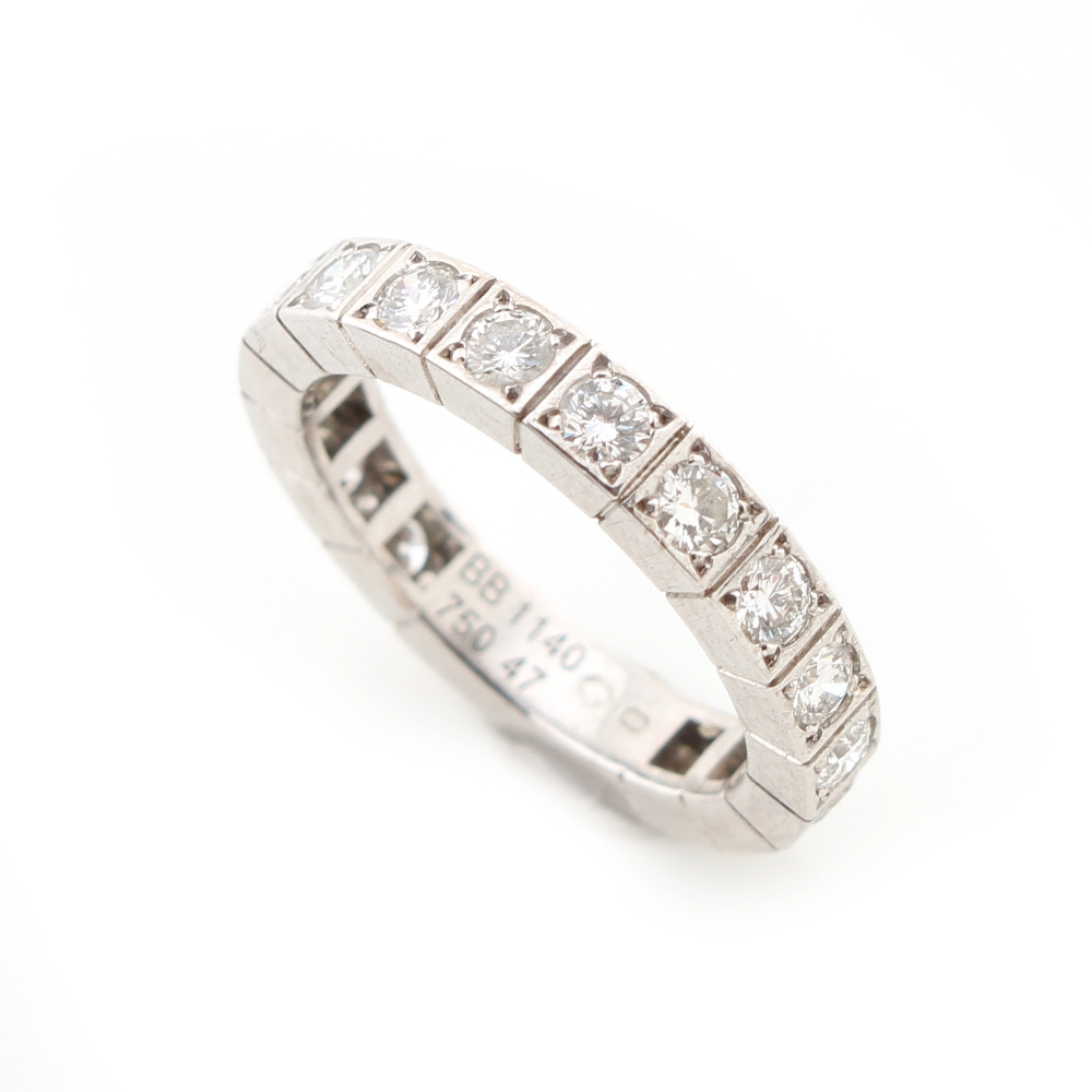 Cartier - a platinum diamond eternity ring by Cartier, set with sixteen round brilliant cut