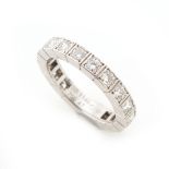 Cartier - a platinum diamond eternity ring by Cartier, set with sixteen round brilliant cut