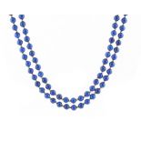 Property of a lady - a lapis lazuli two strand necklace, the ninety-two uniform beads each