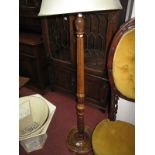 A XX Century Standard Lamp, with reeded and turned pedestal, on a circular base.