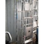 A Three Height Set of Wall Ladders; together with a set of step ladders and steps.