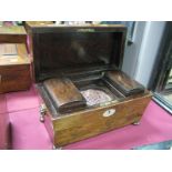 A XIX Century Rosewood Tea Caddy, with a sarcophagus top, mother of pearl insert, lion mask handles,