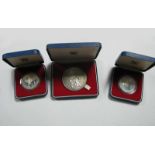 A Royal Mint 1977 Silver Jubilee Elizabeth II Medallion, two Royal Mint silver proof commemorative