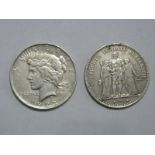 A United States Silver Peace Dollar Coin, 1922; together with a French 5 Francs Coin, 1876 'A'.