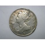 Queen Anne Halfcrown, 1707 E Mint in near fine condition, edge damage to above head, and scratches