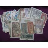 In Excess of Fifty Overseas Circulated Banknotes, including Central Bank of Ceylon Ten Rupees (