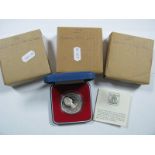 Four Cased Silver Crown Sized Coins, including U.K 1980 Queen Mother commemorative crown,