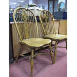 A Pair of XIX Century Style Ash Elm Windsor Chairs, with hooped backs, on turned legs, crinoline