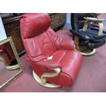 A Stressless Style Red Leather Recliner; on circular base.