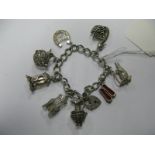 A Curb Link Charm Bracelet, to heart shape padlock clasp, suspending numerous novelty charm