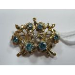 A Modern Floral Design Blue Zircon Set Brooch/Pendant.