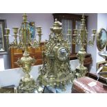 A Large Cast Brass Clock Garniture, profusely decorated with classical ornament, foliate scrolls and
