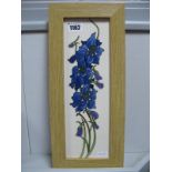 A Moorcroft Pottery Plaque, painted with the Delphinium pattern designed by Kerry Goodwin, 29 x 9.