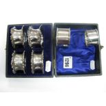 A Matched Set of Four Hallmarked Silver Napkin Rings, WB Ltd, Birmingham 1904, 1905, in a fitted