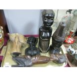 Carved African Hardwood Figure of Kneeling Man, 36.5cm high; two ebonised examples as lamp bases,