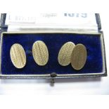 A Pair of Chester Hallmarked 9ct Gold Gent's Cufflinks, the engine turned oval panels on chain