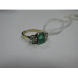 An Emerald and Diamond Three Stone Ring, square set to the centre between two claw set brilliant cut