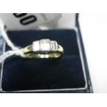 A Modern 18ct Gold Three Stone Diamond Ring, collet rubover set with three rectangular cut stones,