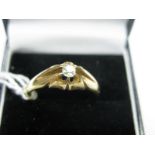 A Victorian Single Stone Diamond Ring, the old cut stone claw set between openwork shoulders.