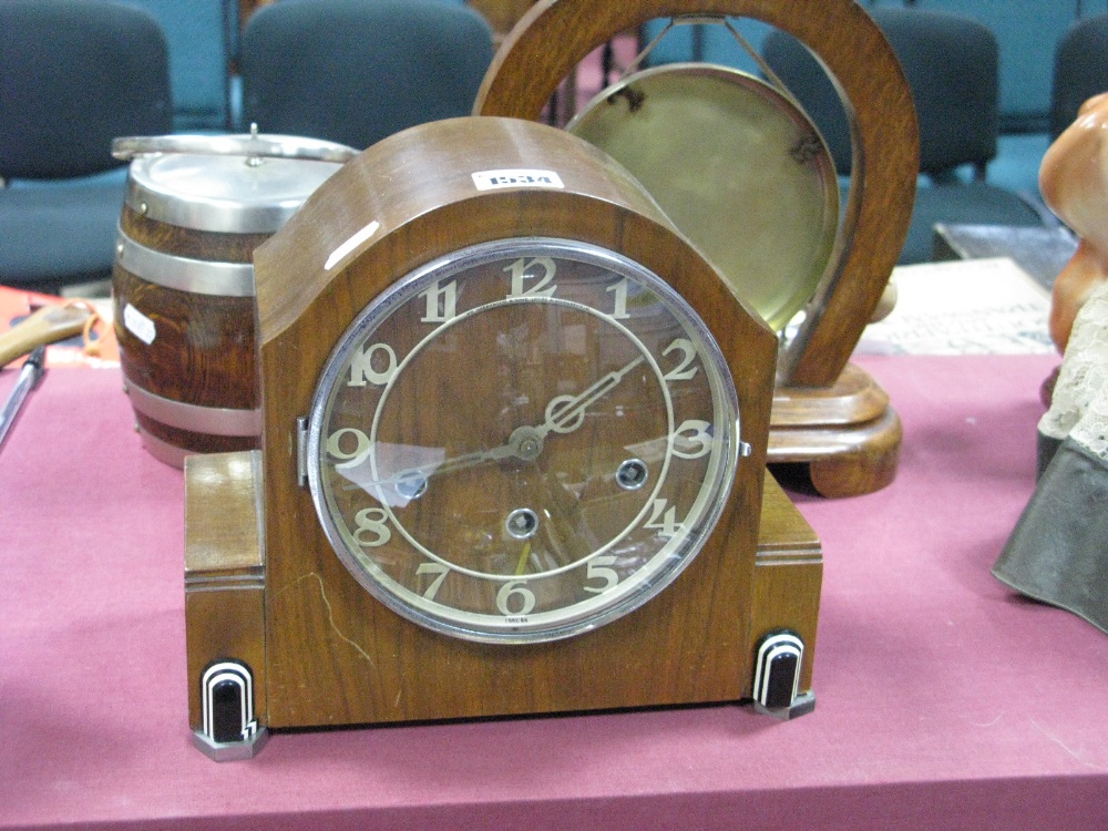 An Art Deco Walnut Cased Mantel Clock, with black and white bakelite mounts, Westminster Chimes