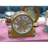 An Art Deco Walnut Cased Mantel Clock, with black and white bakelite mounts, Westminster Chimes