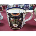 A XIX Century Derby Porter Mug, hand painted Imari decoration of flowers and foliage, leaf capped