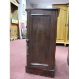 A XiX Century Mahogany Pot Cupboard, with a low back, panelled door, on a plinth base.