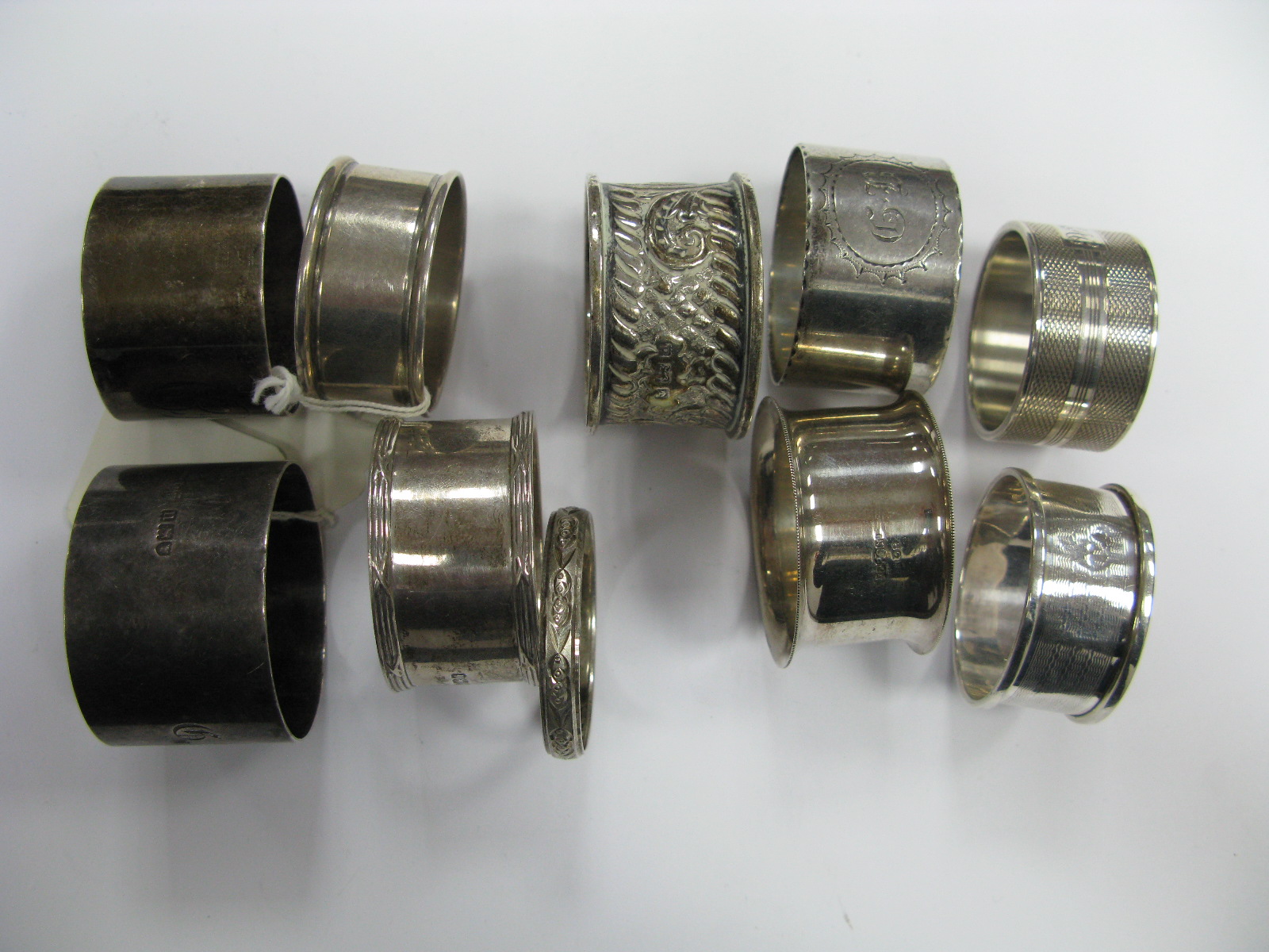 Hallmarked Silver and Other Napkin Rings, including engine turned, initialled, etc.