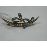 An Edwardian Turquoise and Pearl Set Bar Brooch, as a crescent with ribbon tied detail (one