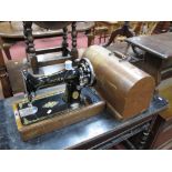 Singer Sewing Machine, in oak domed case.