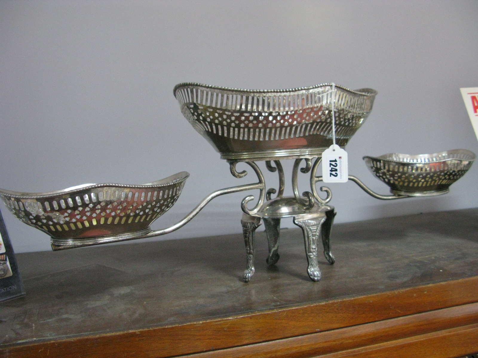 White Metal Table Centrepiece, with pierced central basket, two others smaller on outstretched