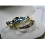 A 9ct Gold Stone Set Wishbone Ring, a 9ct gold claw set seven stone ring and another 9ct gold