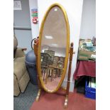 A XX Century Pine Cheval Mirror, with oval mirror, acorn finials to turned and block supports,