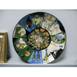 A Moorcroft Pottery Circular Plate, painted with the Twelve Days of Christmas pattern designed by
