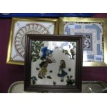 A Framed Tile (Alice in Wonderland); together with two other framed tiles.