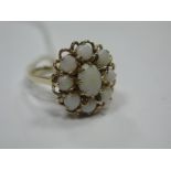 A 9ct Gold Opal Set Cluster Ring, of openwork design.