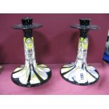 A Pair of Moorcroft Pottery Candlesticks, painted with the Basset-Lowke pattern designed by Vicky