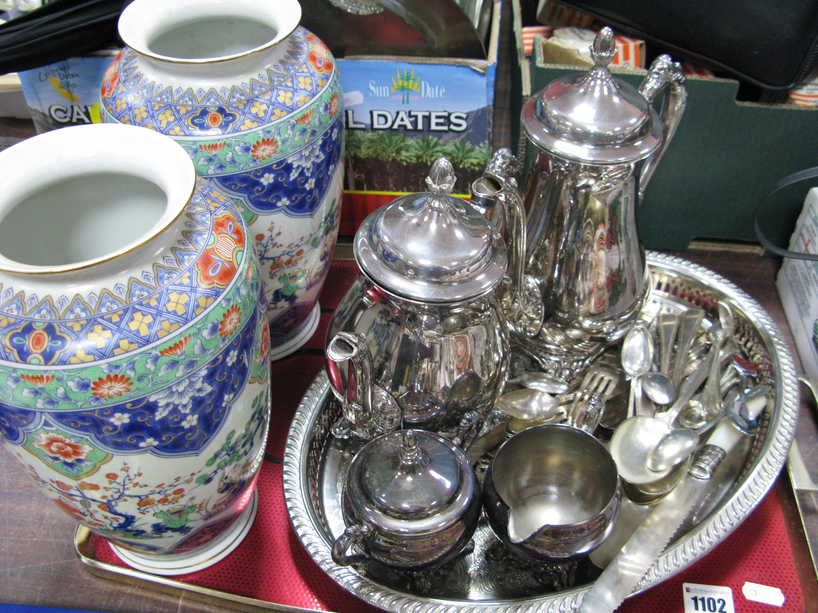 Silver Plated Four Piece Tea Set, cutlery, oval tray and two vases decorated in the Chinoiserie