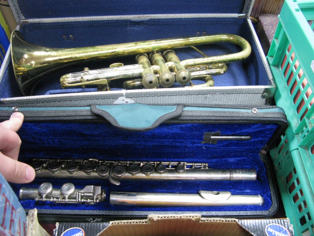 A Boosey & Hawkes Brass Trumpet, plus Chinese lark flute (both cased).