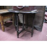 Oak Folding Table, circa 1920's, with oval top, on bobbin supports.