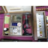 A Mid XX Century Boxed Junior Microscope, with attachments and slides; plus a further box containing