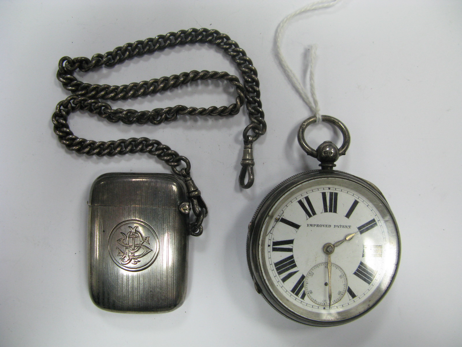 A Hallmarked Silver Vesta Case, allover engine turned and initialled; together with a Chester