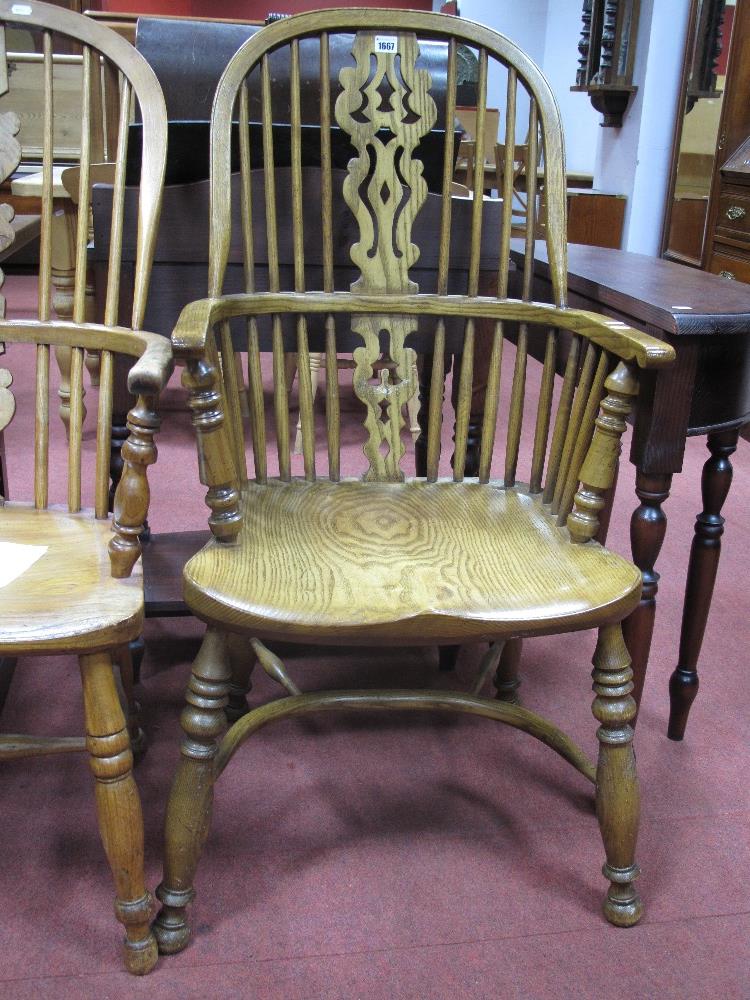 A XIX Century Style Ash Elm Windsor Chair, with a hooped back, pierced splat, on turned legs, united