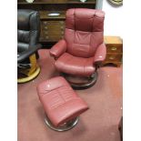 A Stressless Wine Coloured Leather Chair; together with footstool on circular bases.